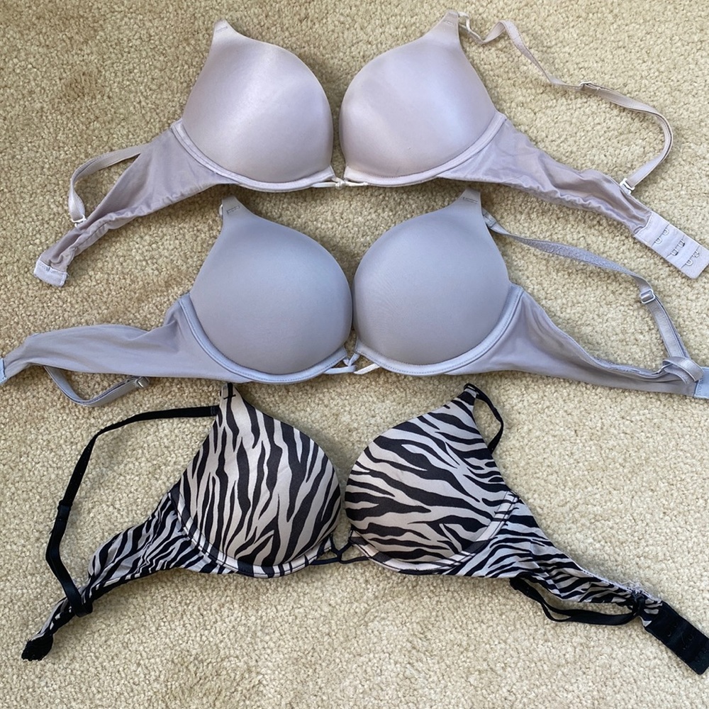 Victorias Secret Bombshell bra bundle. Comes
with 3 34A bras, white, pink, zebra